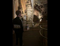 Woman in black top tiktok dance inside the cave