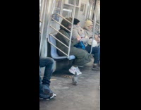 Woman pour snack in train floor for pigeon