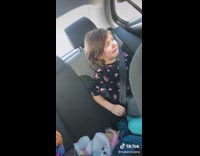 Little kid in backseat of car crying changes mood eating feels better