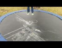 Boy jump on trampoline with ice slowmo