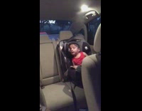 Little boy red shirt sleeping car seat car wakes up baby shark