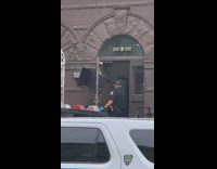 Cop opens door smashed window glass apartment 