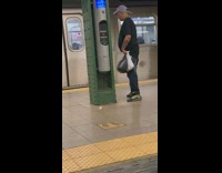 Man pees on green emergency call pole 