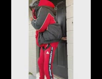 Guy goes out of front door on cold day, puts on oven mitts then slips and falls