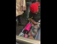 Collab Subway Creatures - Woman red hair puts legs out on seat and paints her nails on subway train