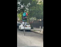 Collab winy - Man ride tall unicycle on street nyc