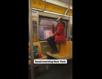 Guy sits on top of seat to smoke out window 