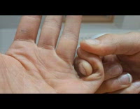 Guy bend his pinky finger sideward 