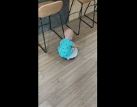 Baby blue shirt ride on roomba vacuum
