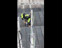 Man hang on building show coworker pose