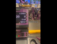 Girl on elliptical at gym