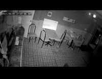 Man robs restaurant struggles to get out