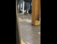 Guy pees on trash can subway station 