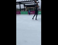 Kid black jacket ice skate fall down