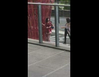 Tall red sticks sculpture lady red dress