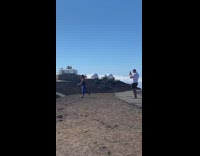 Woman blue pants raise hands jump shot