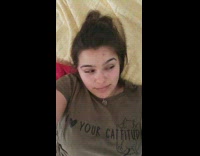 Kitten jump on face of girl