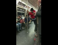Collab Subway Creatures - Woman red jacket holds onto poles and shakes but on subway train