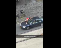 Woman twerks on the car that moves