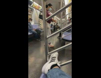 Woman red jacket tiktok dance train subway