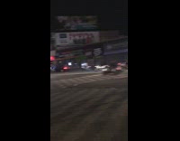 Biker gang drives down a street and revs engines