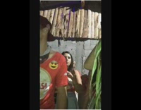 guy red shirt spins on palm tree branch