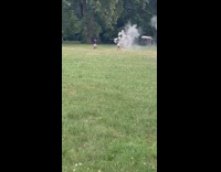 Woman blue tube dress white smoke bomb