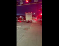 Truck trailer hit by train on railroad