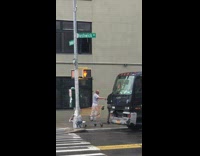 Guy Loads Out Trash from Second Floor of Building 