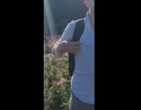 Girl two large white showgirl feathers garden 