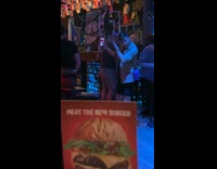 Man films selfie dance video in bar