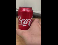 Crumpled unopened coke can no pressure hiss