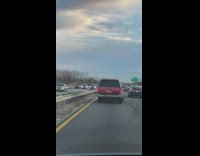 Red car drives lopsided 