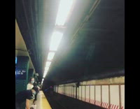 Guy blue gloves thrusts exercises subway platform 