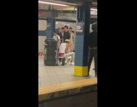 Guy plays drums with buckets 