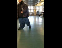 Guy sings Rudolph the red nose reindeer with cup of change and asks for donations