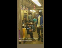 three guys move black leather couch on train