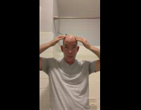 Bald man make light reflection dance on shiny head