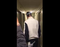 Guy in white windbreaker jacket with ugly split haircut