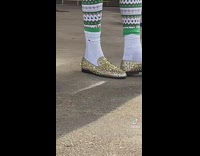 Guy wear shoes with small gold spikes