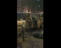 Parked gold minivan car all doors open