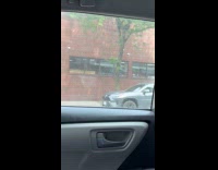 Man ride bike with tire on head