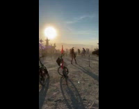 Woman bra top dances near Burning Man stage