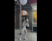 Man Wrapped in Plastic Hushes as he Walks