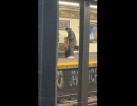 Man plays with animal fur at subway