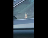 Girl car talks rants to phone window 