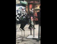 person black and white checkered sweater unicorn head