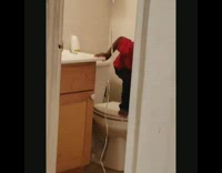 Little boy hides his medicine in cabinet because he doesn't want to take it