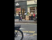 Woman white sleeves basket of vegetables street