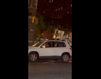 Woman dance inside car hazard on street
